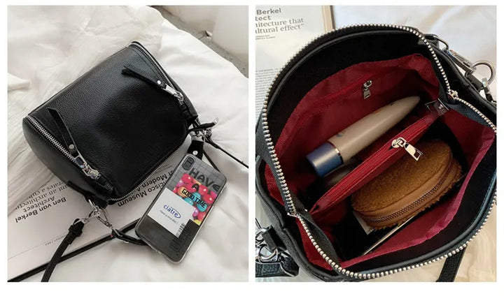 Schwarze Lederhandtasche mit Reißverschluss, Innenfächer, rote Fütterung, Damenmode Accessoire.