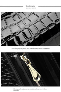 Schwarze Handtasche aus Krokodillederimitat mit goldfarbenem Reißverschluss, elegant und stilvoll.