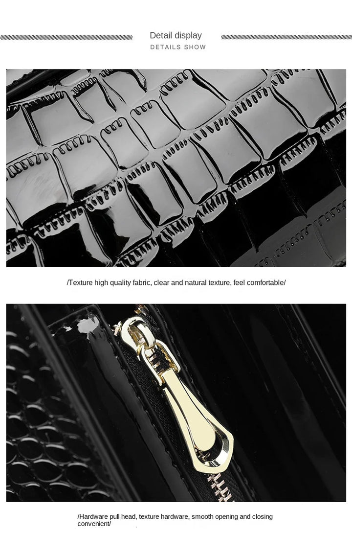 Schwarze Handtasche aus Krokodillederimitat mit goldfarbenem Reißverschluss, elegant und stilvoll.