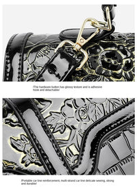 Schwarze Lederhandtasche mit glänzendem Blumenmuster und abnehmbarem goldfarbenem Haken.