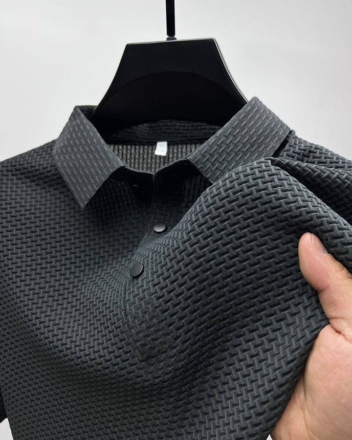 Dunkelgraues Polohemd mit strukturiertem Muster, Kurzarm, Baumwolle, Herrenmode.