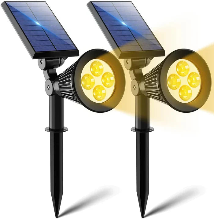 Zwei schwarze Solar-LED-Gartenstrahler mit gelbem Licht, wetterfest, energiesparend.