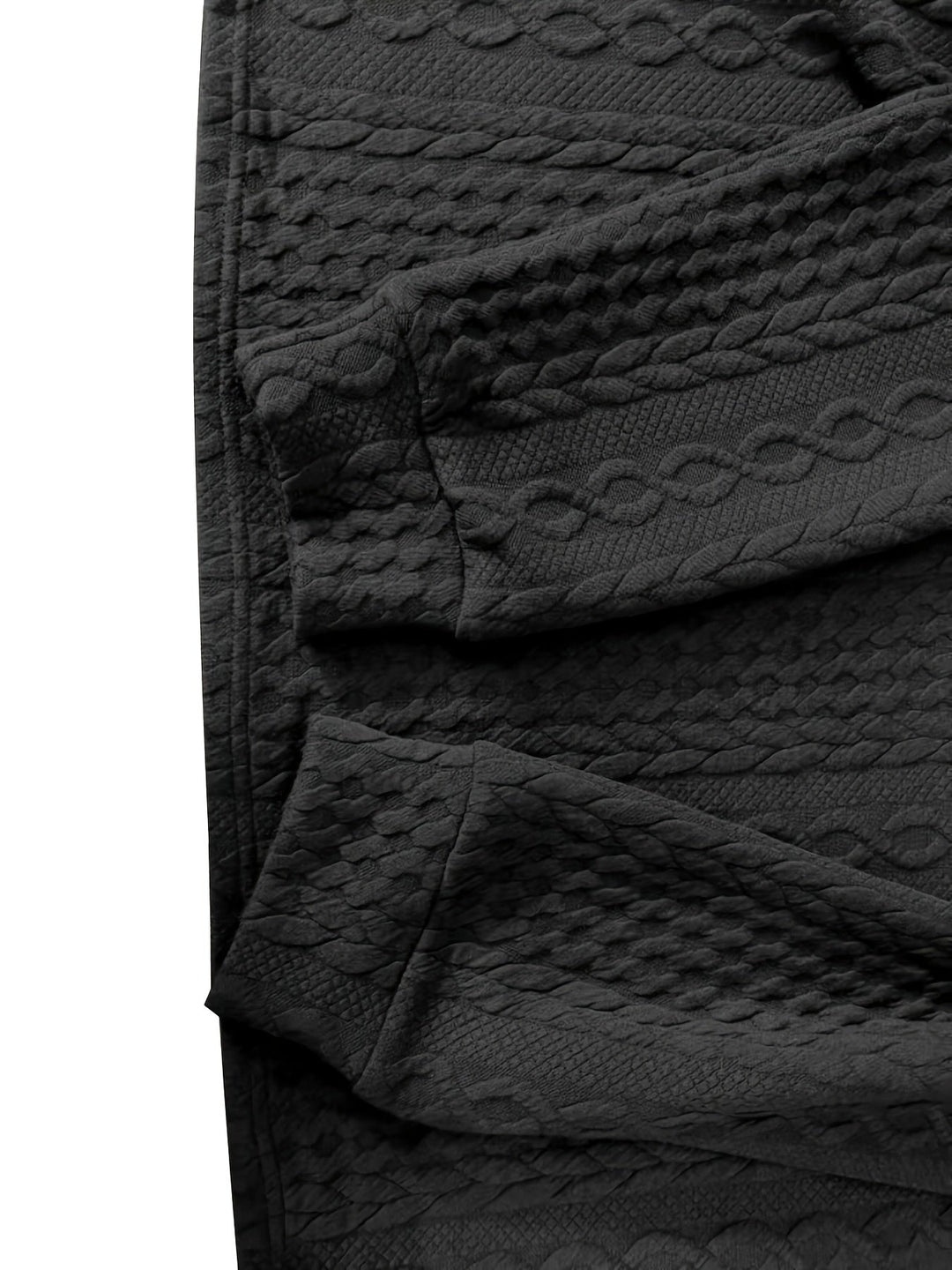 Schwarze, strukturierte Leggings aus Baumwolle mit Zopfmuster, modisch und bequem.