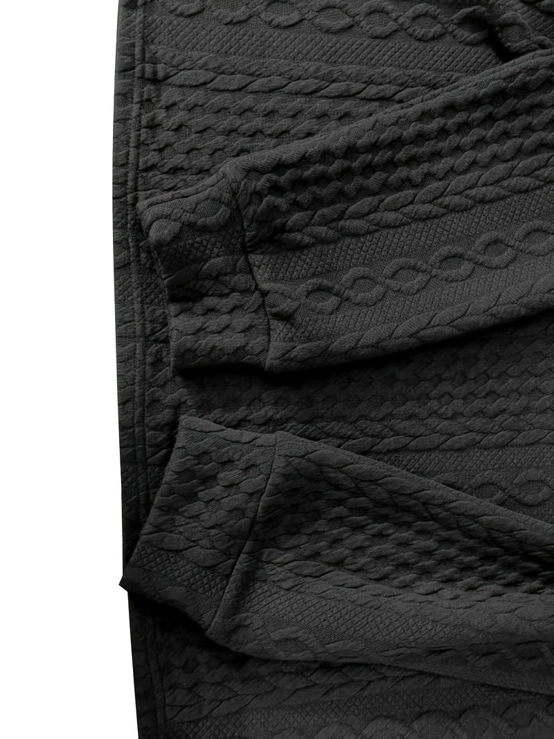 Schwarze, strukturierte Leggings aus Baumwolle mit Zopfmuster, modisch und bequem.