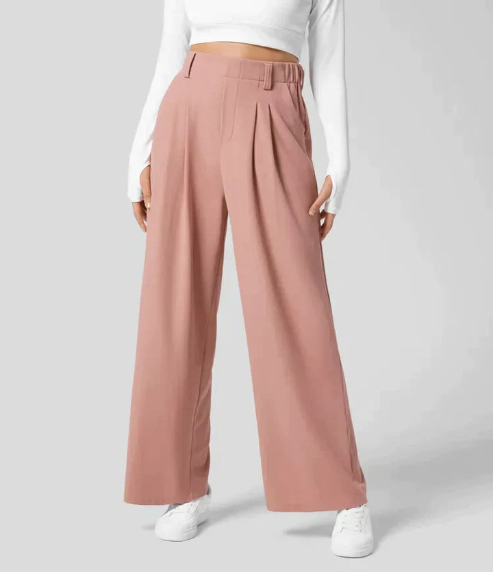 Damenhose, rosa, weit geschnitten, elegant, aus Stoff, modisch, ideal für Büro oder Freizeit.