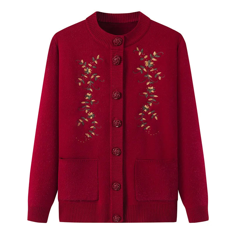 Rote Damenstrickjacke mit Blumenstickerei, Knopfleiste, Taschen, Herbstmode.