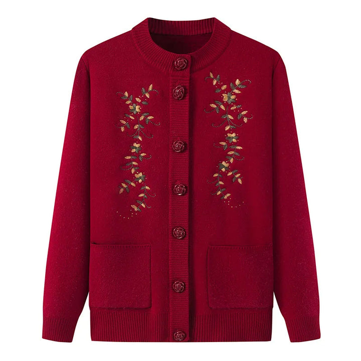 Rote Damenstrickjacke mit Blumenstickerei, Knopfleiste, Taschen, Herbstmode.