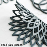 Graue Silikon-Untersetzer, lebensmittelecht, hitzebeständig, rutschfest, geometrisches Design.