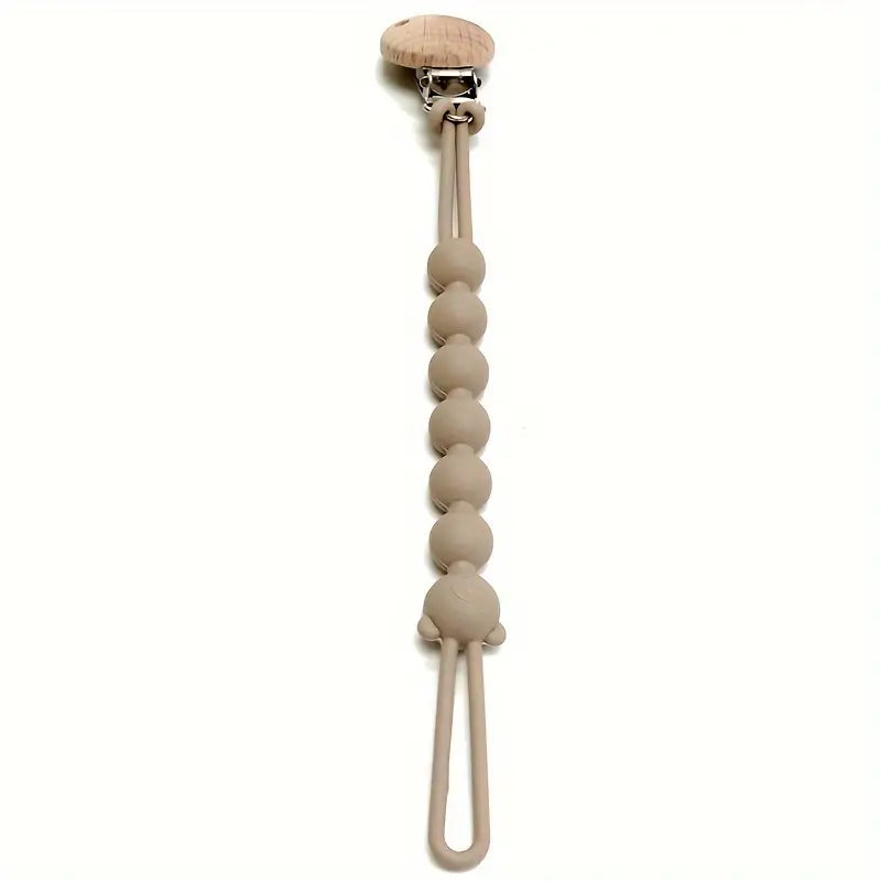 Beige Schnullerkette aus Silikon mit Holzclip, babyfreundlich, BPA-frei, langlebig.
