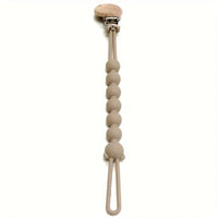 Beige Schnullerkette aus Silikon mit Holzclip, babyfreundlich, BPA-frei, langlebig.