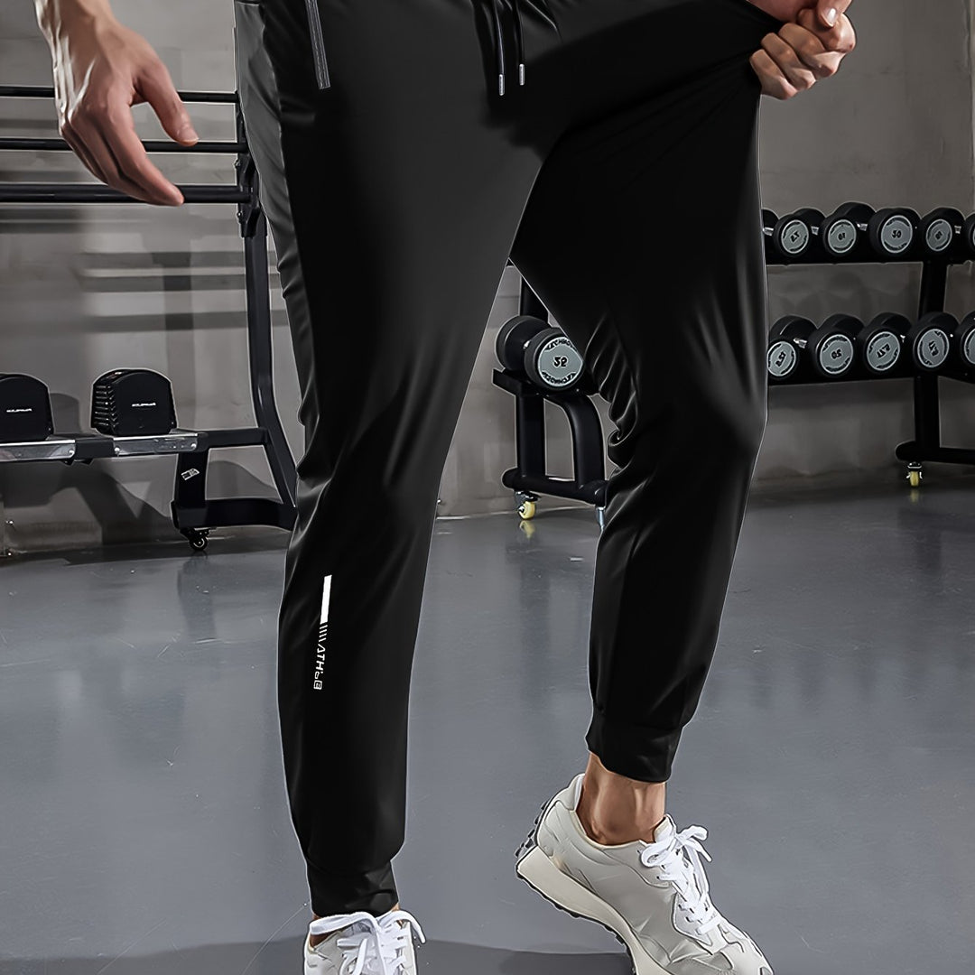 Schwarze Jogginghose Herren, Fitnessstudio, atmungsaktiv, elastisch, Sportbekleidung, modern.