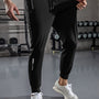 Schwarze Jogginghose Herren, Fitnessstudio, atmungsaktiv, elastisch, Sportbekleidung, modern.