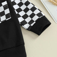 Schwarz-weiß kariertes Langarmshirt aus Baumwolle mit Tasche, Kinderkleidung, modisch.