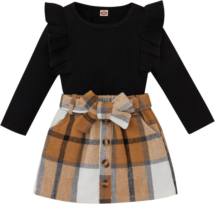 Schwarzes Kinderkleid mit kariertem Rock, Rüschenärmeln und Schleife, Herbstmode.
