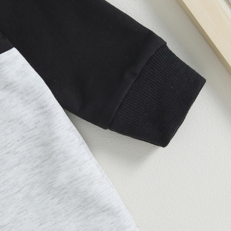 Schwarz-weißer Langarm-Pullover, Baumwolle, gerippte Bündchen, modisch, bequem, Unisex.