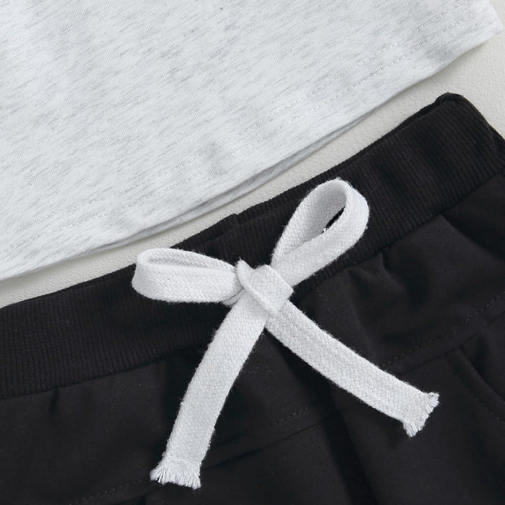 Schwarz-weiße Jogginghose mit Kordelzug, Baumwolle, bequem, Freizeitkleidung für Damen.