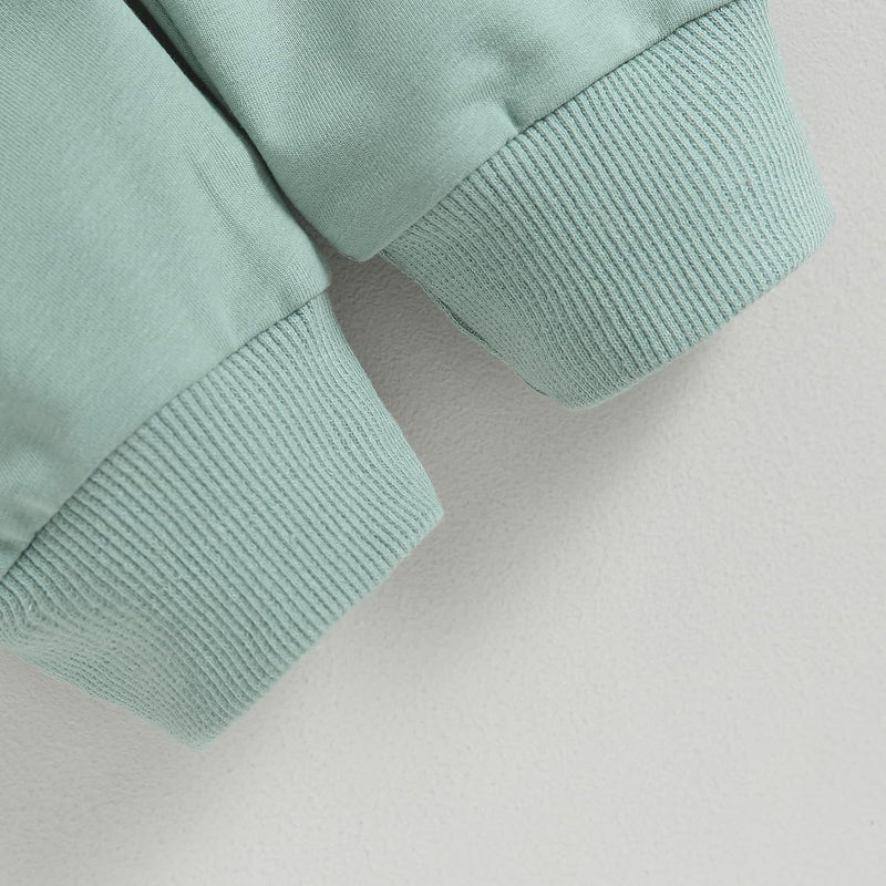 Mintgrüner Baumwollpullover, gerippte Bündchen, weiches Material, modisches Design, Damenmode.