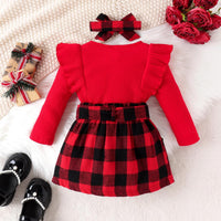 Rotes Kinderkleid mit Rüschen, kariertem Rock und Haarband, festlich, Weihnachten, Mädchenmode.