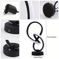 Schwarze LED-Tischlampe, modern, geschwungenes Design, 27 cm hoch, mit Netzteil.