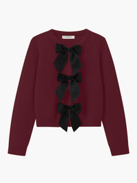 Damenpullover bordeaux mit schwarzen Schleifen, Strick, elegant, modisch, Herbstmode.