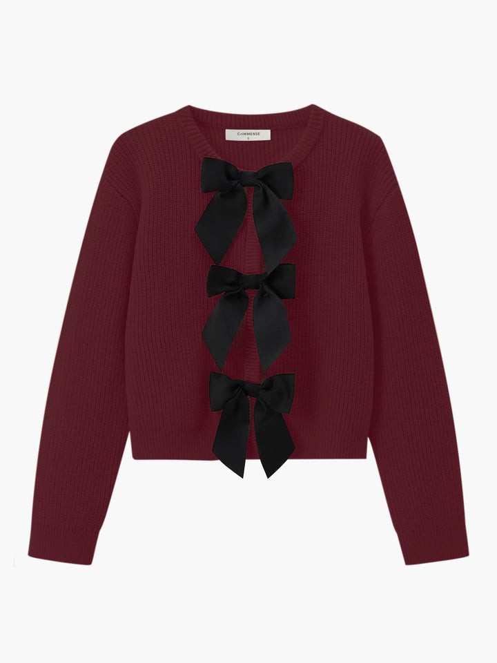 Damenpullover bordeaux mit schwarzen Schleifen, Strick, elegant, modisch, Herbstmode.