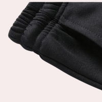 Schwarze Jogginghose, elastischer Bund, Baumwolle, bequeme Sportbekleidung, Herrenmode.