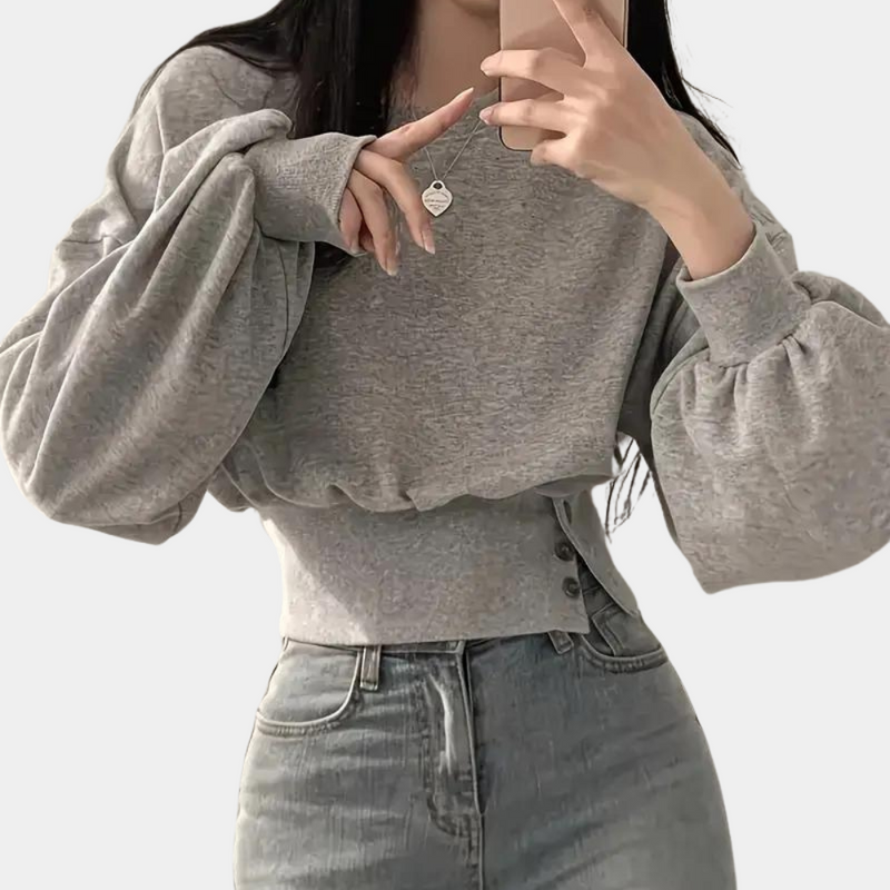 Grauer Damenpullover mit Ballonärmeln, modisch, bequem, Herbstmode, Freizeitkleidung.