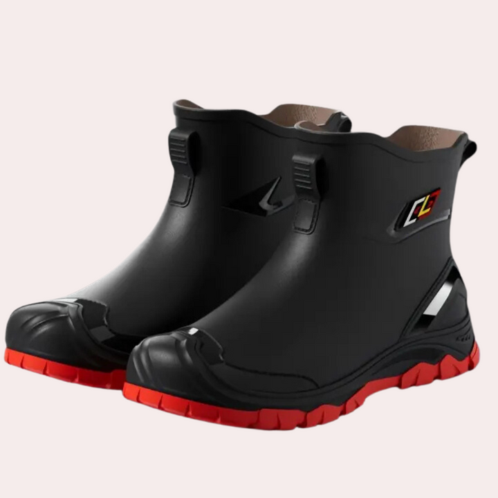 Schwarze Gummistiefel mit roter Sohle, wasserdicht, rutschfest, für Outdoor-Aktivitäten.