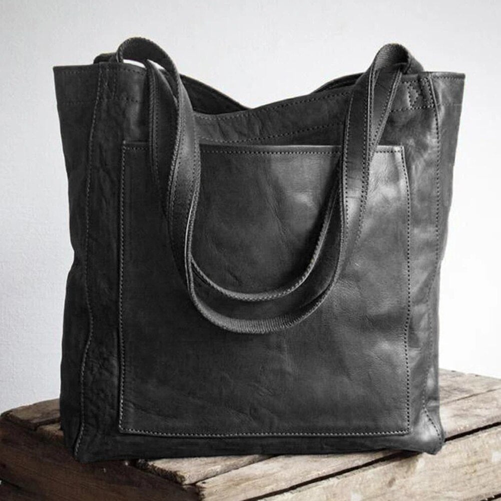 Schwarze Damen-Ledertasche, Vintage-Stil, große Schultertasche, modisch und elegant.
