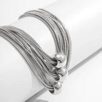 Silbernes Armband mit Kugelanhängern, Edelstahl, modernes Design, Schmuck für Damen.