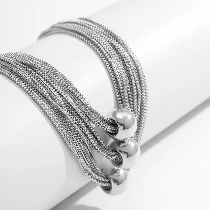 Silbernes Armband mit Kugelanhängern, Edelstahl, modernes Design, Schmuck für Damen.