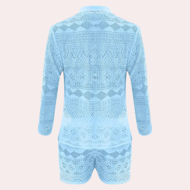 Hellblauer Spitzen-Jumpsuit, langärmlig, geometrisches Muster, modisch, Damenbekleidung.