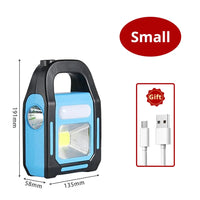 Tragbare blaue LED-Campinglampe mit USB-Ladekabel, kompakt, ideal für Outdoor-Abenteuer.