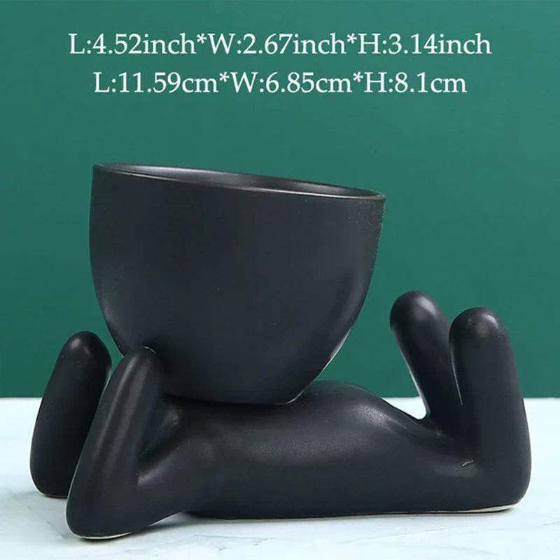 Schwarzer Keramik-Blumentopf in Form einer liegenden Figur, modern, dekorativ, 11,59 cm.