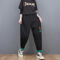 Schwarze Baggy-Jeans Damen, lässig, mit grünem Saum, modisch, Streetwear, Baumwolle.