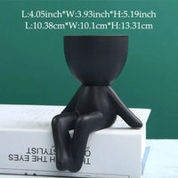 Schwarzer Keramik-Blumentopf in menschlicher Form, modern, dekorativ, für Innenräume.