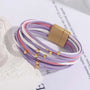 Mehrfarbiges Lederarmband mit Magnetverschluss, lila, rosa, weiß, goldene Details, Damenmode.