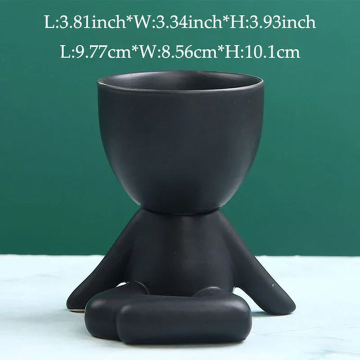 Schwarzer Keramik-Blumentopf in Form einer sitzenden Figur, modern, dekorativ, 10 cm hoch.