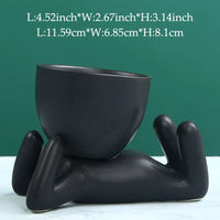 Schwarzer Keramik-Blumentopf in Form einer liegenden Figur, modern, dekorativ, 11,59 cm.