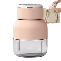 Rosa tragbare Saftpresse, kompakt, ideal für unterwegs, passt in Handtaschen.