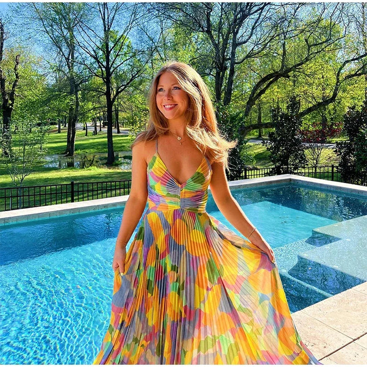 Bedrucktes Sommerkleid mit tiefem Ausschnitt und Schleifendetail – Vivienne