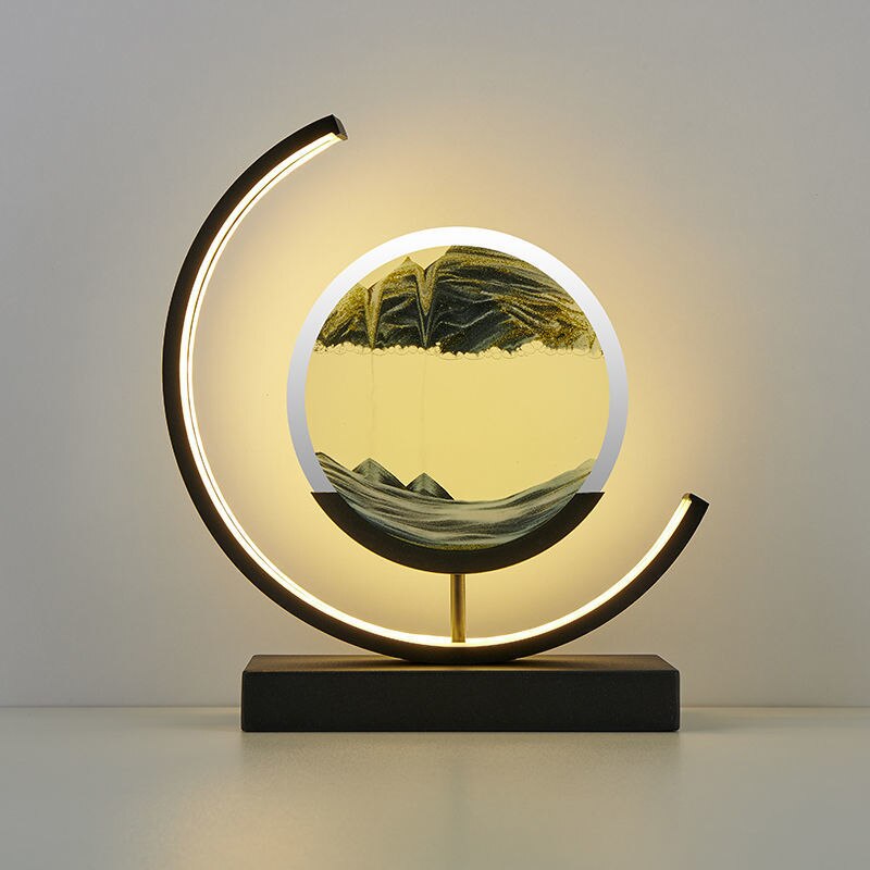 Moderne Sanduhrlampe mit LED-Beleuchtung, schwarz-gold, dekorative Tischleuchte, rundes Design.