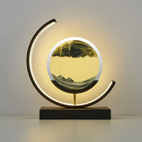 Moderne Sanduhrlampe mit LED-Beleuchtung, schwarz-gold, dekorative Tischleuchte, rundes Design.