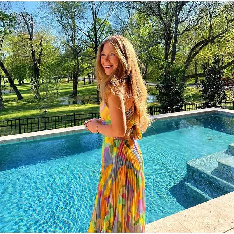 Bedrucktes Sommerkleid mit tiefem Ausschnitt und Schleifendetail – Vivienne