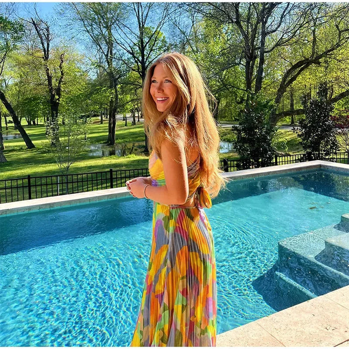 Bedrucktes Sommerkleid mit tiefem Ausschnitt und Schleifendetail – Vivienne