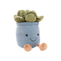 Kuscheltier Sukkulente in blauem Topf, lächelndes Gesicht, grüne Blätter, weiches Plüschspielzeug.