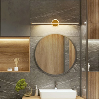 Runder Badezimmerspiegel mit LED-Beleuchtung, modernes Design, Holz- und Steinelemente.