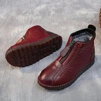 Warme, rutschfeste, bequeme, rote Lederstiefel mit Reißverschluss für Damen.