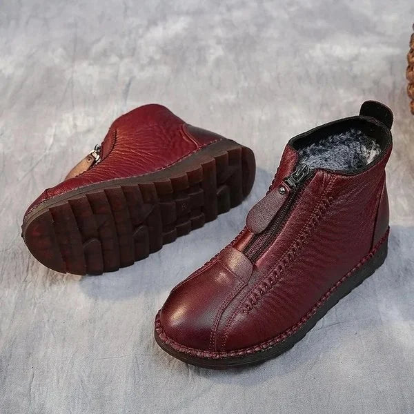 Warme, rutschfeste, bequeme, rote Lederstiefel mit Reißverschluss für Damen.