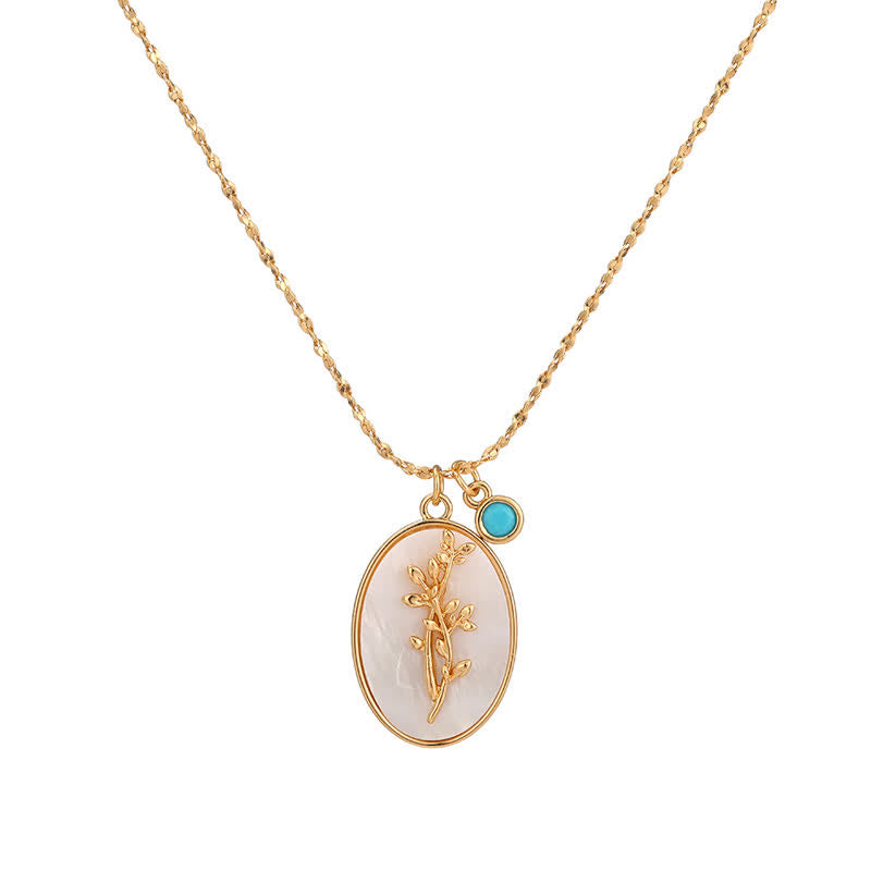 Goldene Halskette mit ovalem Anhänger, Blumenmotiv, türkisfarbener Akzent, Damen-Schmuck.